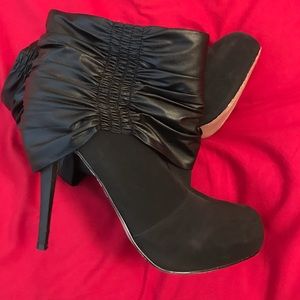 J lo high heeled booties, slight wear to bottoms.